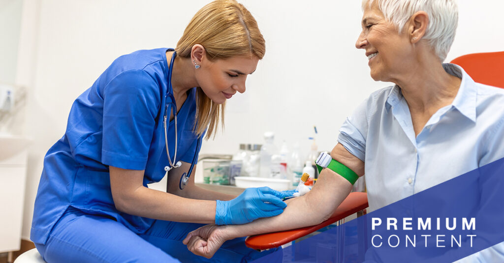 Nurse taking patient's blood